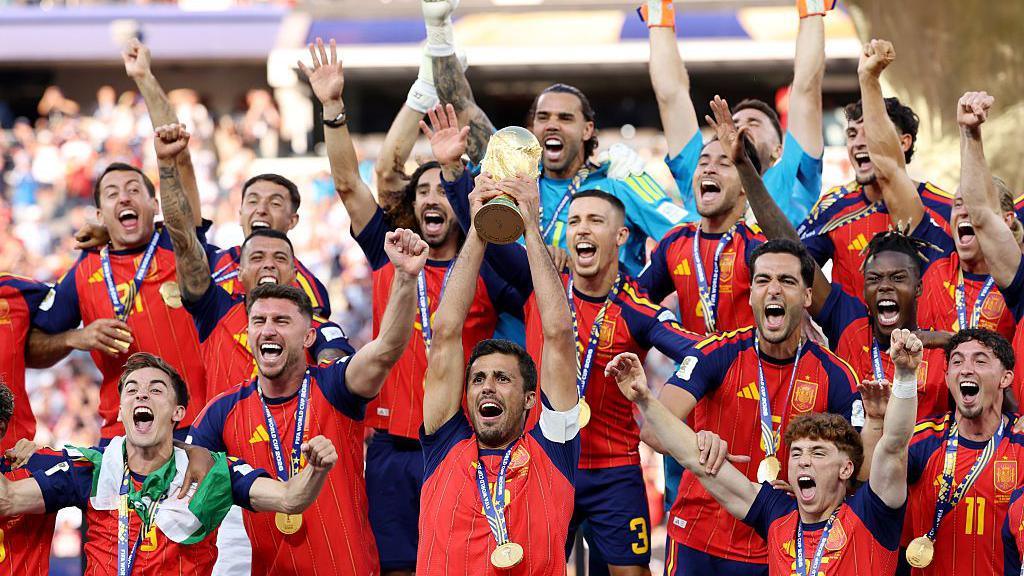 Spain lifting World Cup trophy.