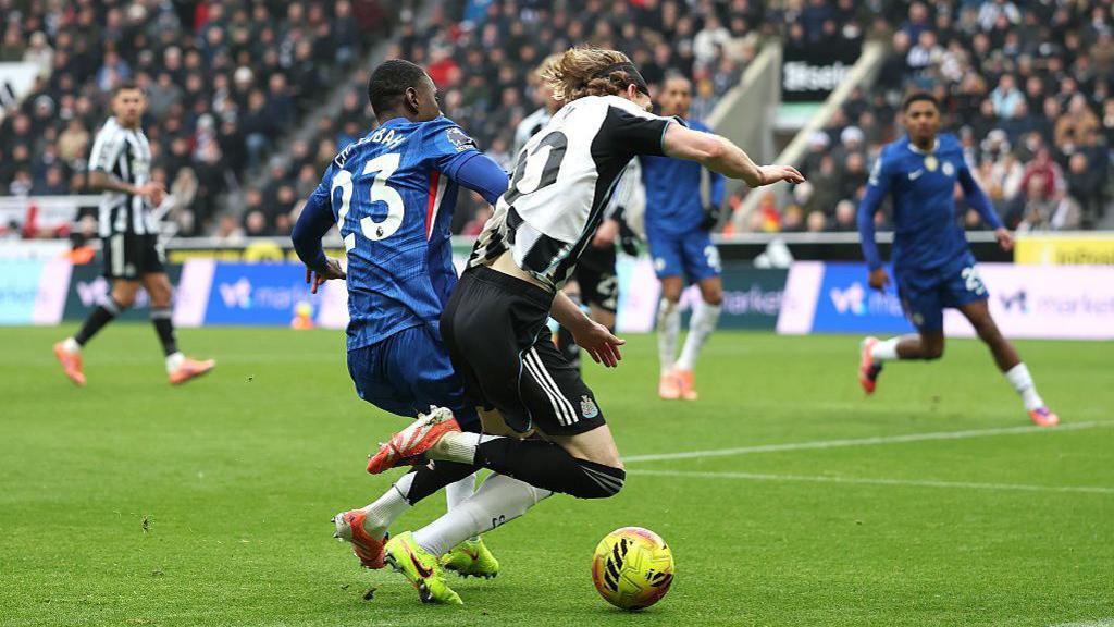 Trevoh Chalobah challenges Anthony Gordon 