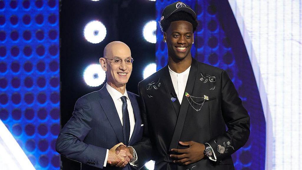 NBA commissioner Adam Silver shaking hands with AJ Dybantsa after he was selected with the first overall pick of the 2026 NBA Draft