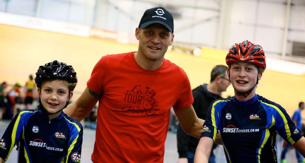 Zoe Backstedt and elder sister Elynor with their father Magnus inside a velodrome