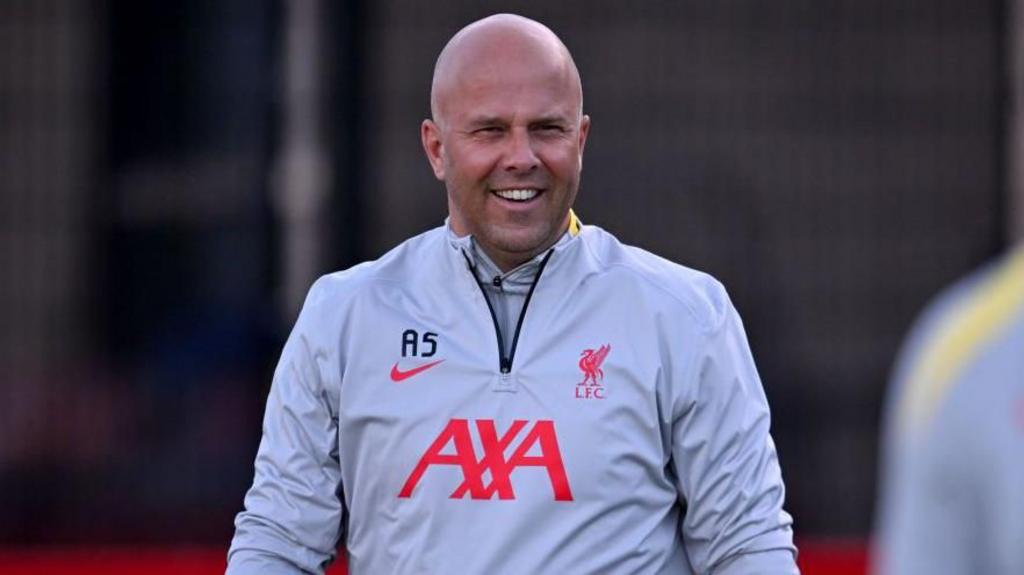 Arne Slot smiling at Liverpool training