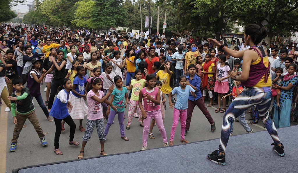 A representative image of a group of children in colourful clothes performing Zumba dance in Gurgaon.