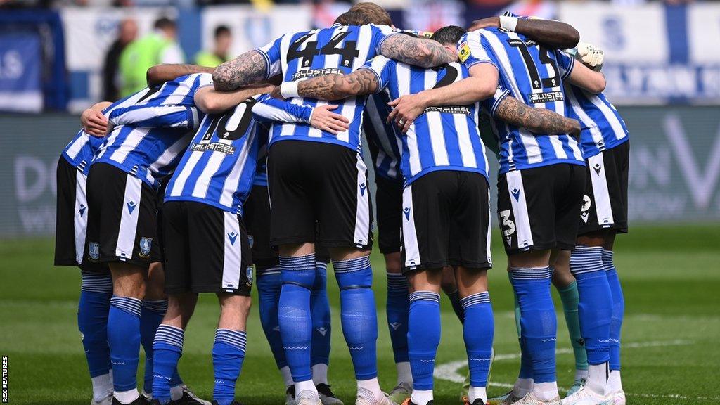 Sheffield Wednesday players in a huddle