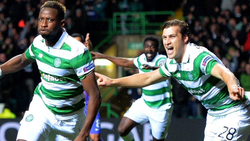 Erik Sviatchenko (right) celebrates Moussa Dembele's goal against Manchester City