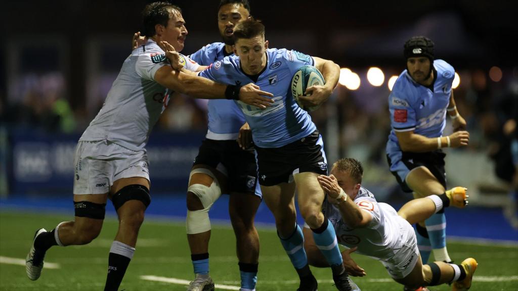 Cardiff's Josh Adams takes on Sharks