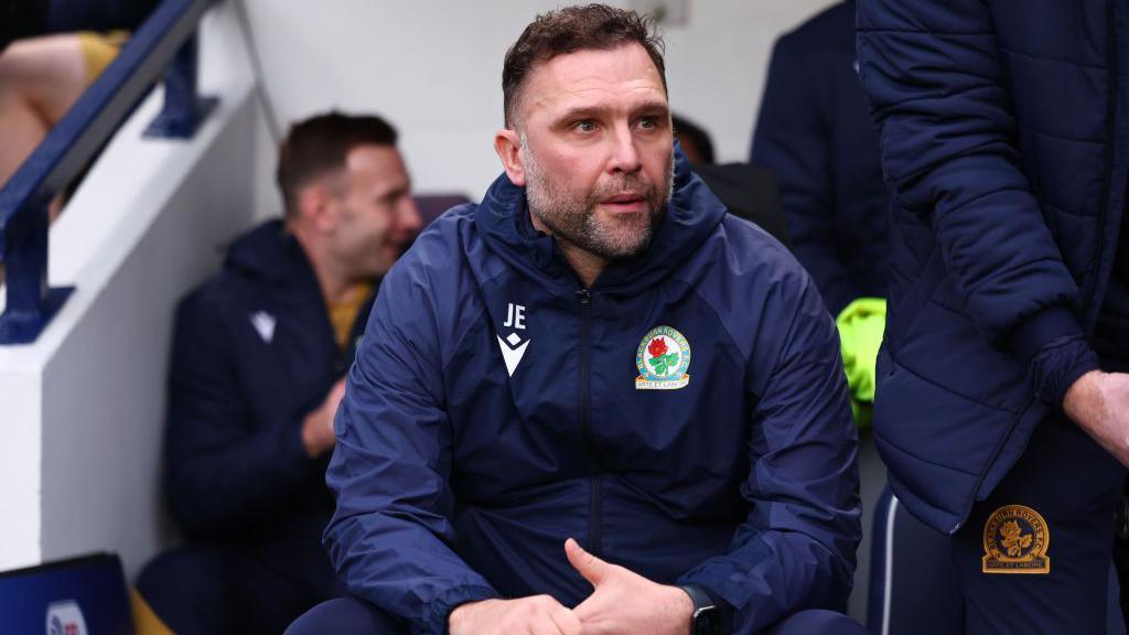 John Eustace, sat in the Blackburn dugout