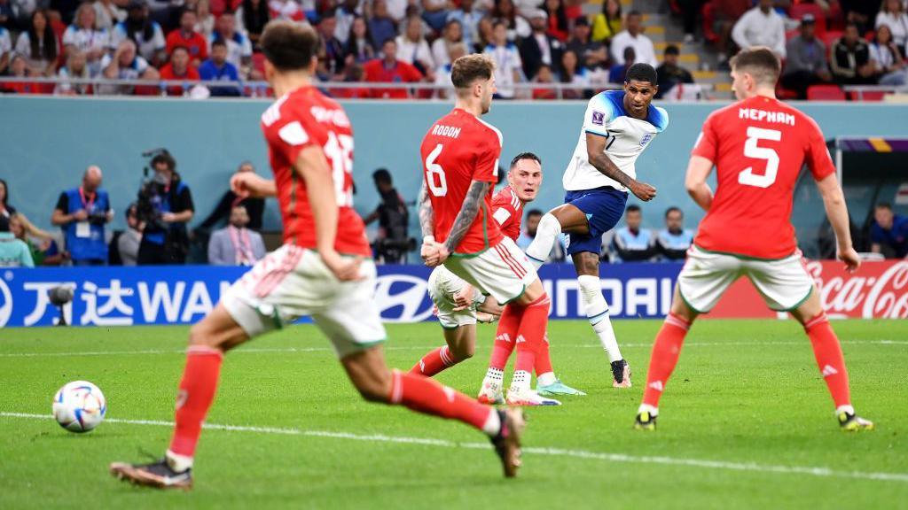 Marcus Rashford shoots for England against Wales