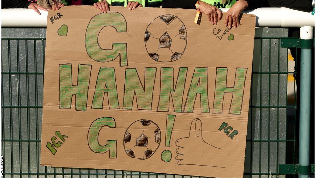 A group of female Forest Green fans held up a placard before the game