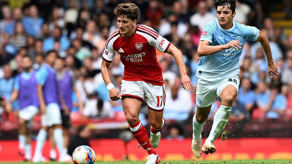 Christos Tzolis accelerates past Manchester City's Abdukodir Khusanov