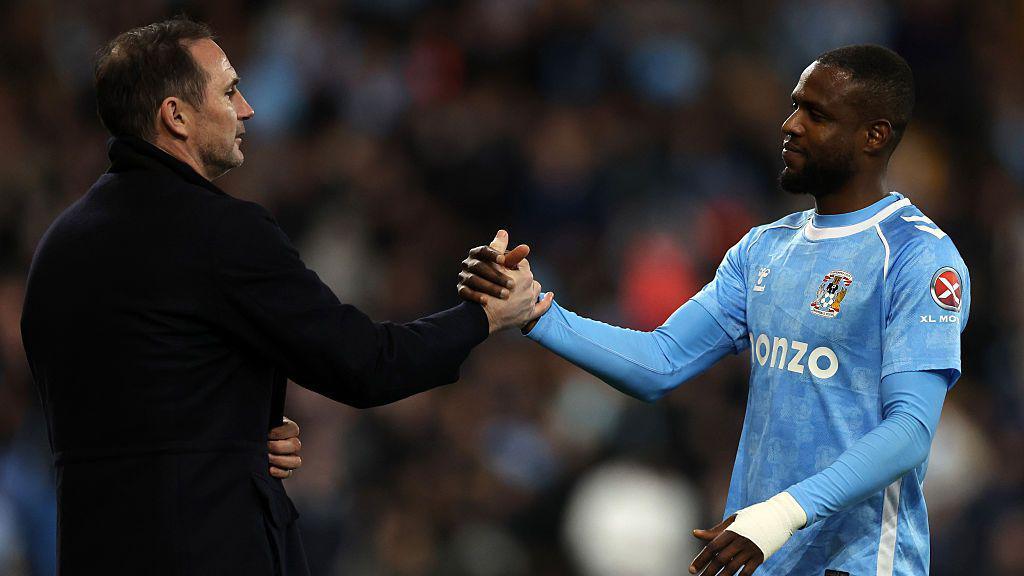 Frank Onyeka shakes hands with Frank Lampard