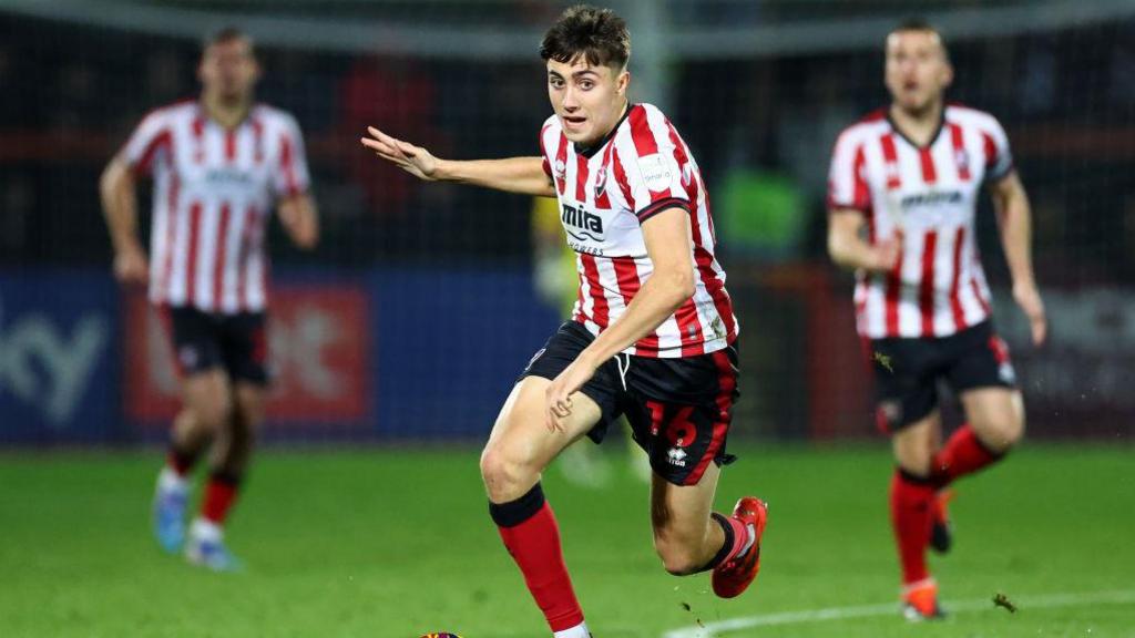 Joel Colwill in action for Cheltenham Town during his loan over the first half of the season