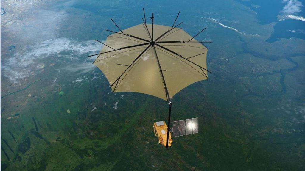 Artist's impression of the Biomass satellite flying over a forest.