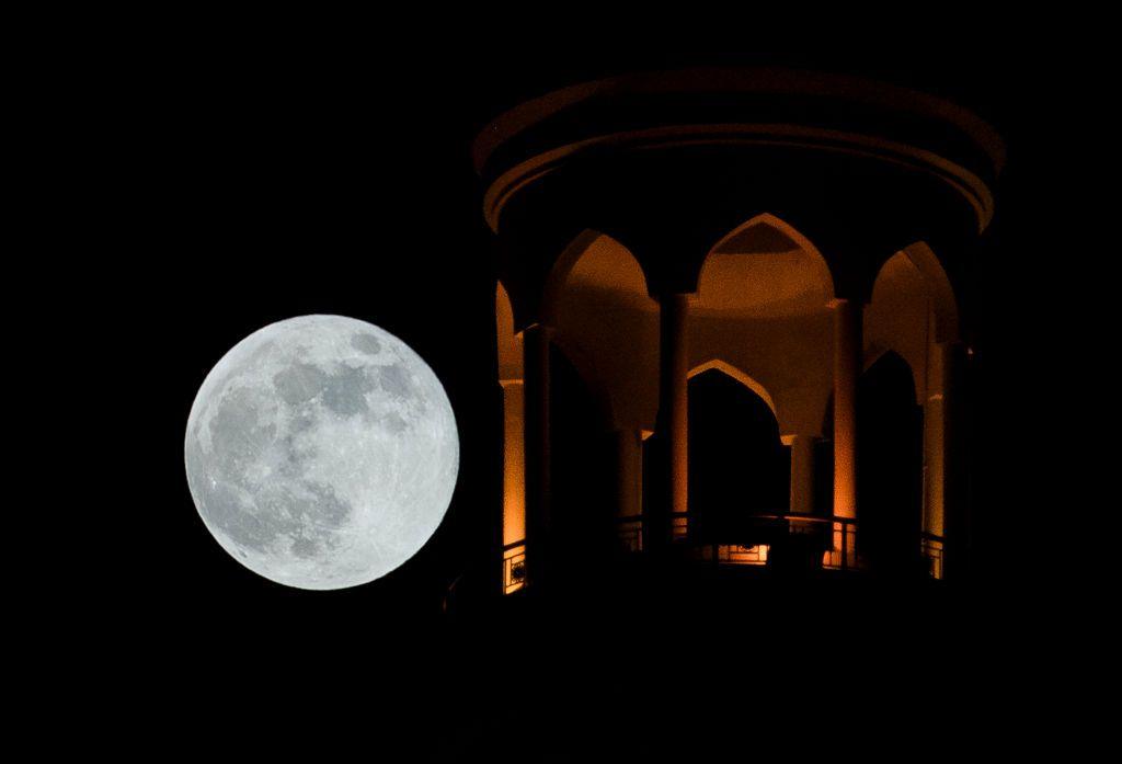 Moon rising behind the Al Fanar Mosque in Doha, Qatar.