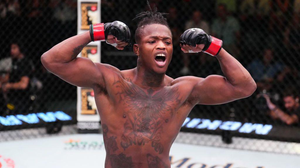 Terrance McKinney celebrates in the octagon after beating Brendon Marotte