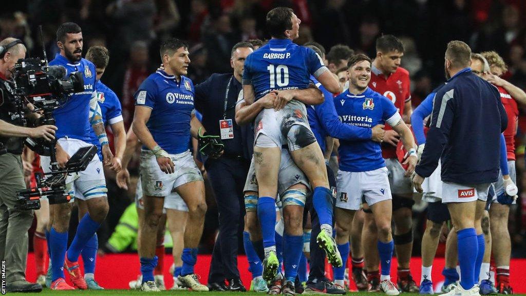 Italy players celebrate their win