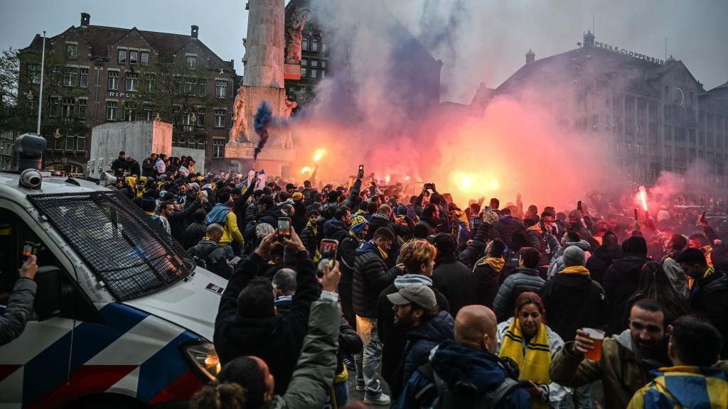 Fans of Maccabi Tel Aviv stage a pro-Israel demonstration at the Dam Square, lighting up flares