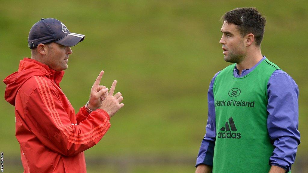 Conor Murray speaks with Jacques Nienaber during a Munster training session in September 2016