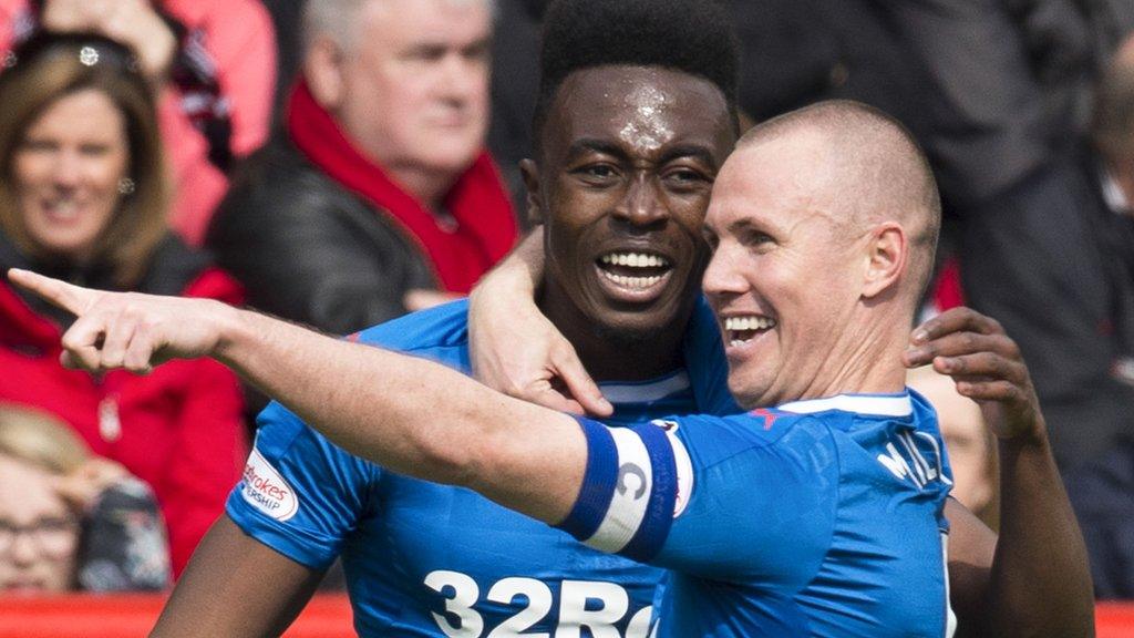 Rangers striker Kenny Miller celebrates a goal with Joe Dodoo