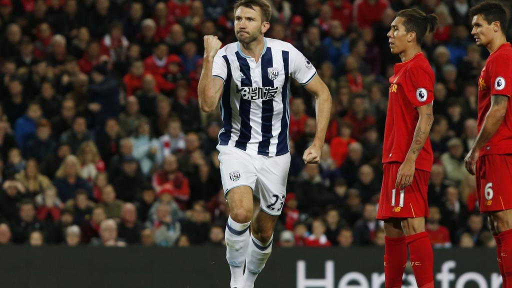 Gareth McAuley celebrates