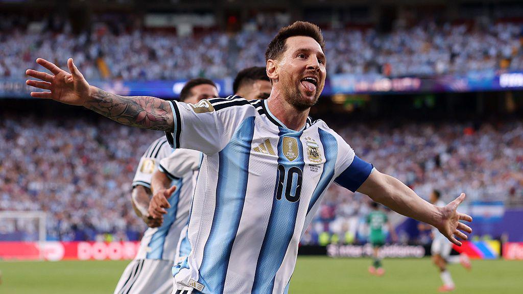 Lionel Messi celebrating scoring a goal.