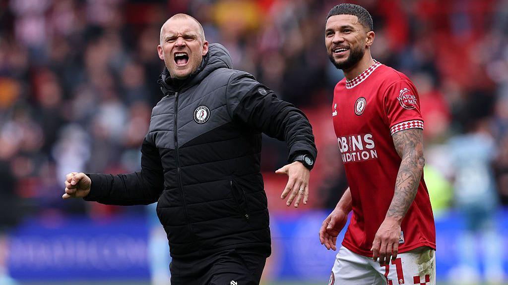 Liam Manning [left] celebrates after Bristol City beat Sunderland in the Championship