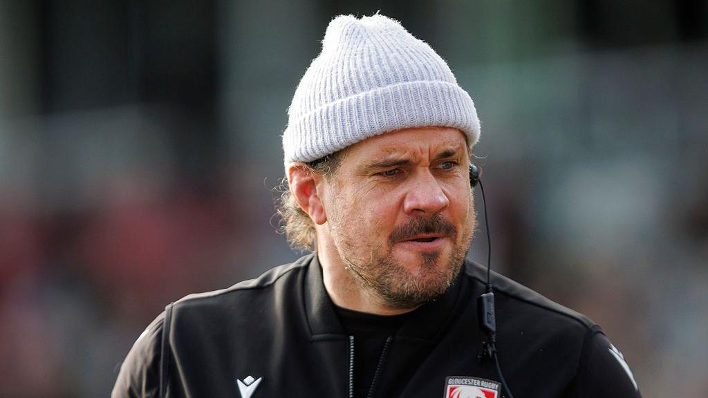 Dan Murphy standing on the pitch during a pre-game warm-up