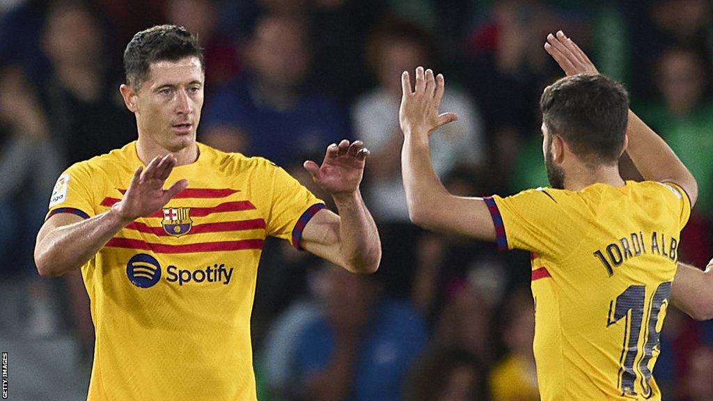 Robert Lewandowski celebrates with Jordi Alba after scoring Barcelona's opening goal at Elche