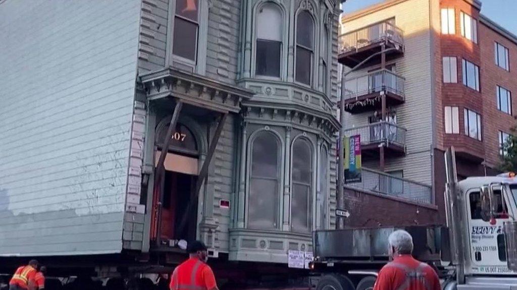 house moving down the road.