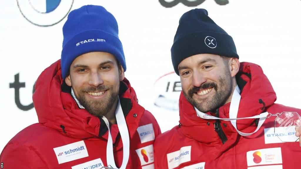 Swiss bobsleigher Sandro Michel (left) crashed in a four-man sled piloted by Michael Vogt