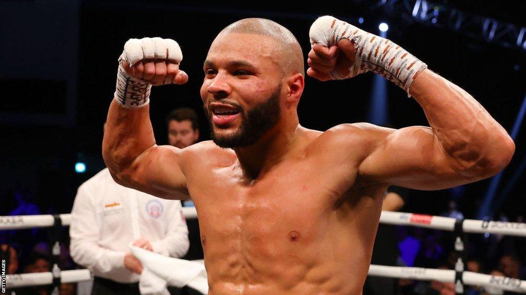 Chris Eubank Jr flexes his muscles posing for pictures in the ring