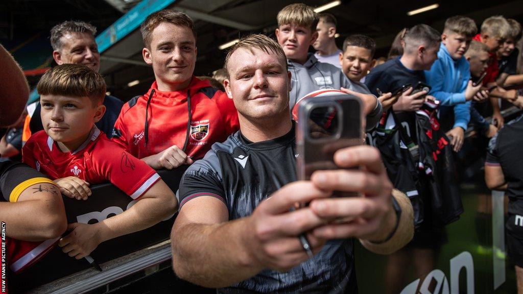 Dewi Lake with Wales fans at an open training session at the Principality Stadium