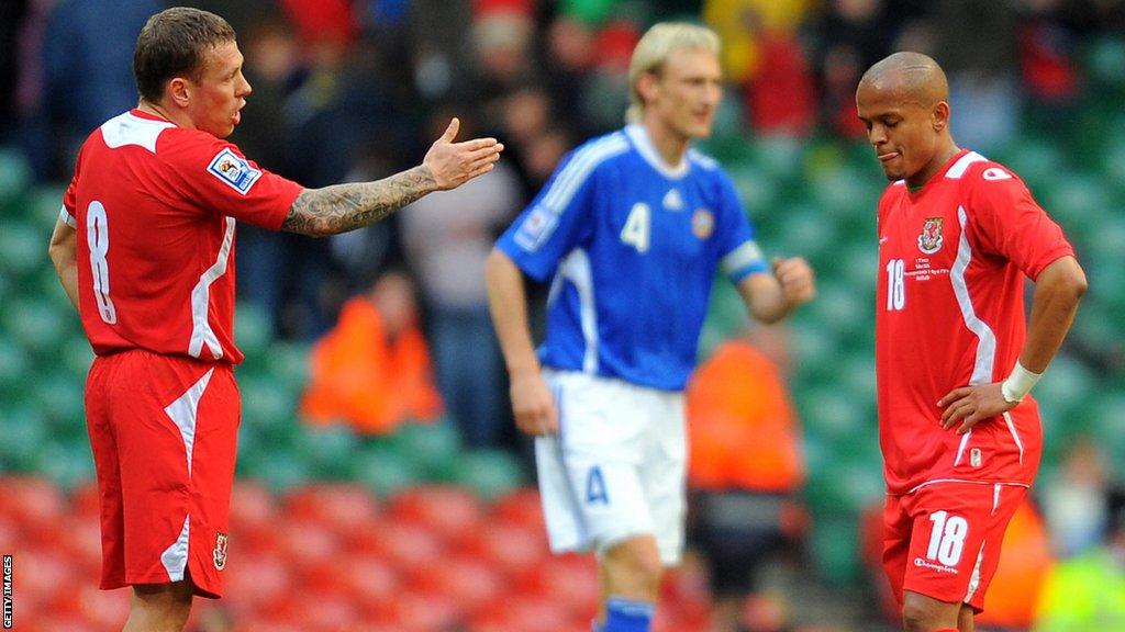 Craig Bellamy (left) makes a point to Robert Earnshaw during Wales' loss to Finland in 2009