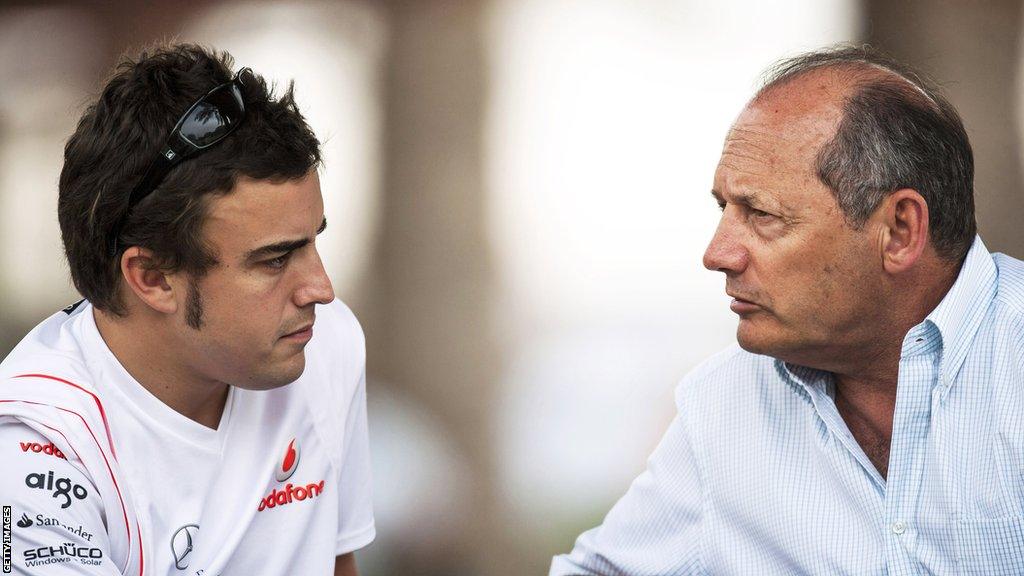 Fernando Alonso and Ron Dennis sit together