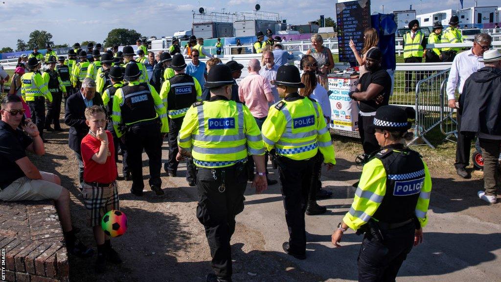 Police officers and crowds at the 2023 Epsom Derby