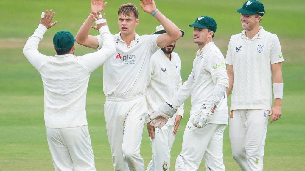 Ben Gibbon celebrates being one of three Worcestershire players to take two wickets at Headingley