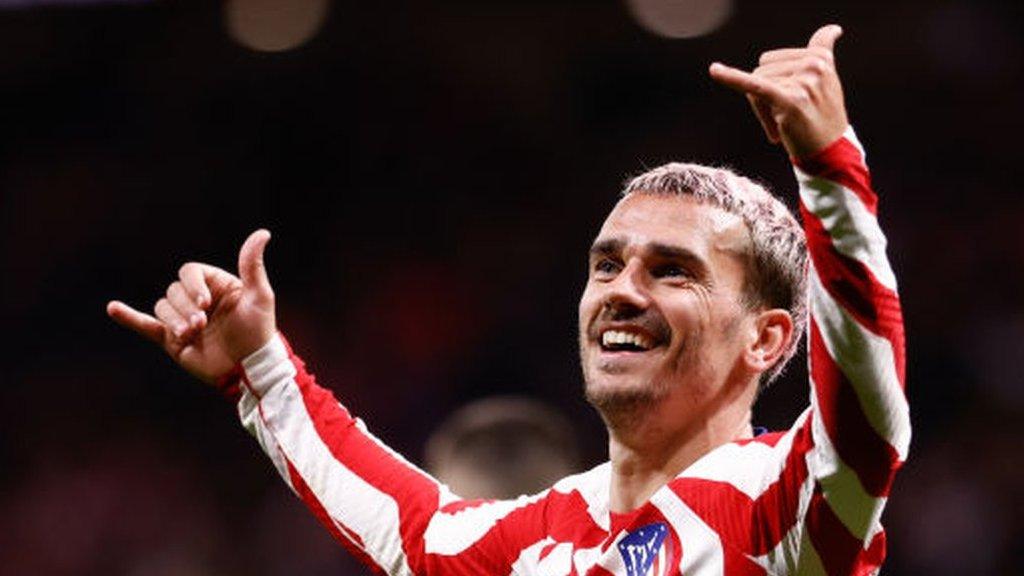 Griezmann performs his trademark goal celebration