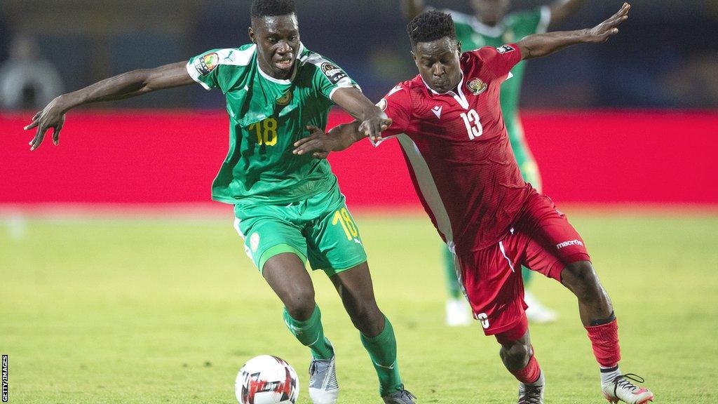 Ismaila Sarr of Senegal and Eric Ouma of Kenya during their 2019 Africa Cup of Nations Group C meeting