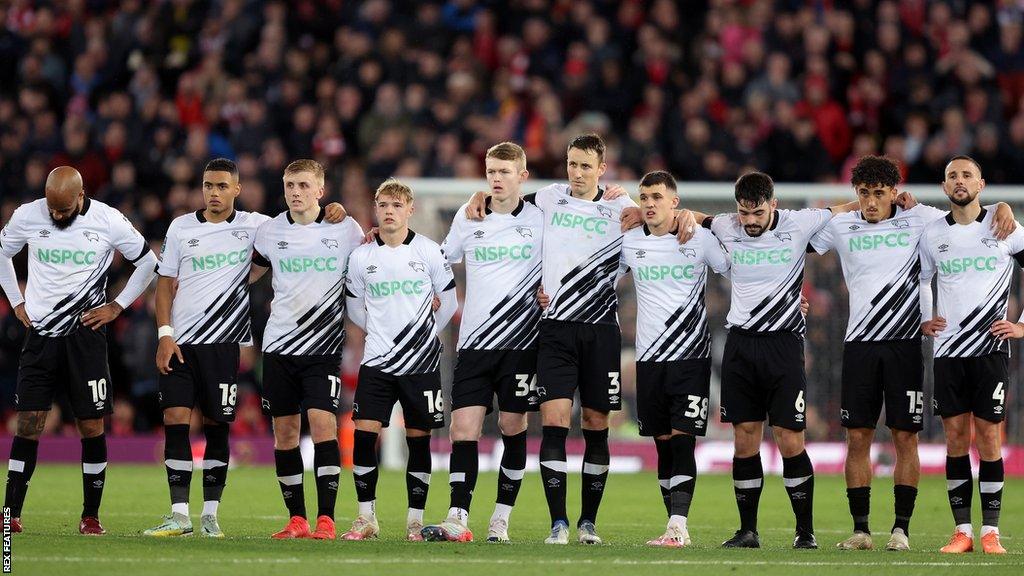 Derby County players lined up for a penalty shootout against Liverpool in the EFL Cup