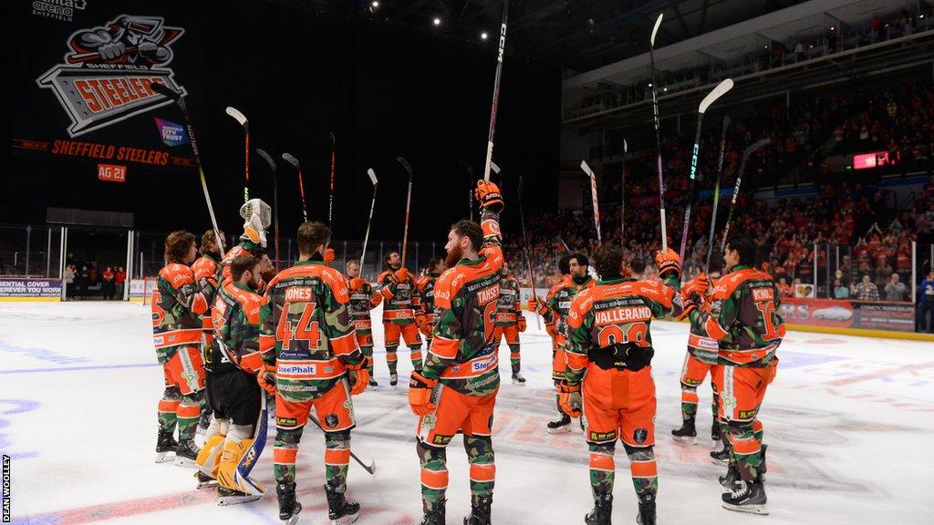 Steelers players raise their sticks to honour Adam Johnson