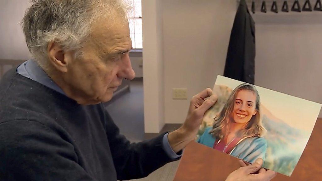 Ralph Nader holding a photo of his niece