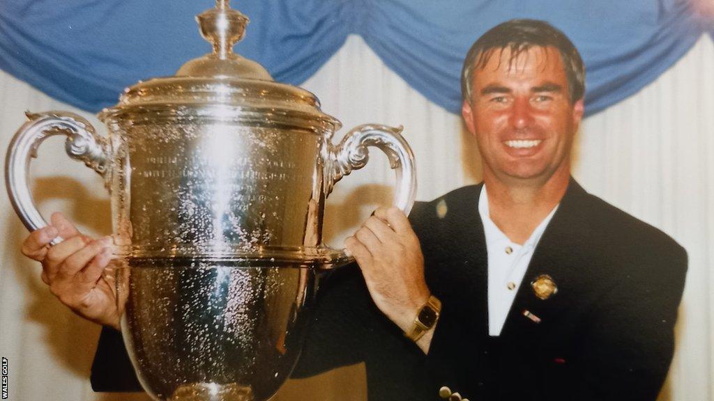 Clive Brown holds the 1995 Walker Cup aloft after GB & Ireland's 14-10 victory over the USA