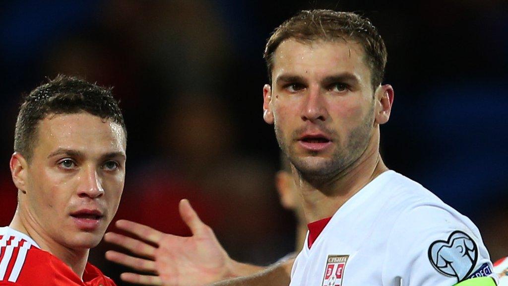 Branislav Ivanovic (R) and Wales' James Chester