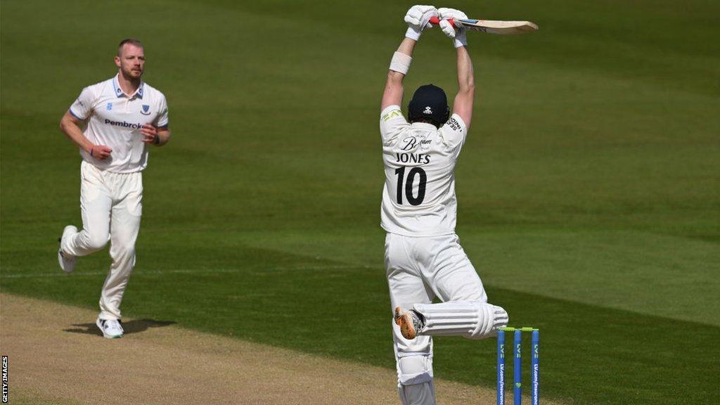 Nathan McAndrew (left) bowling to Michael Jones