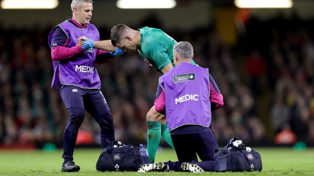 Johnny Sexton receives treatment during the second half of Ireland's dominant win over Wales