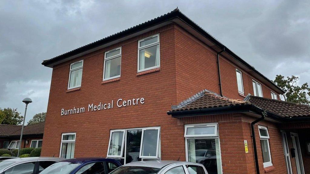 a red brick building saying burnham medical centre