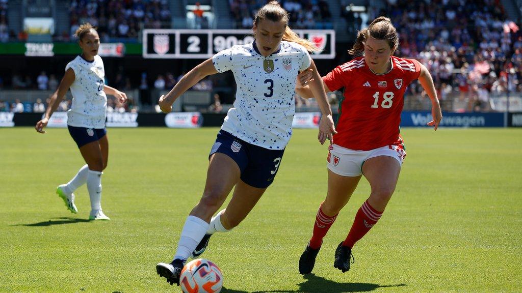 Esther Morgan #18 of Wales competes for the ball against Sofia Huerta #3 of the United States