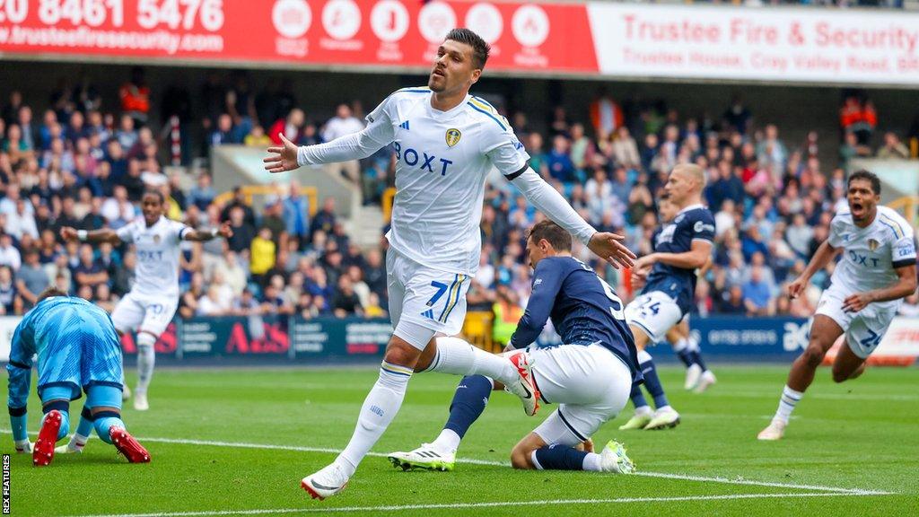 Joel Piroe wheels away in celebration after scoring for Leeds United against Millwall