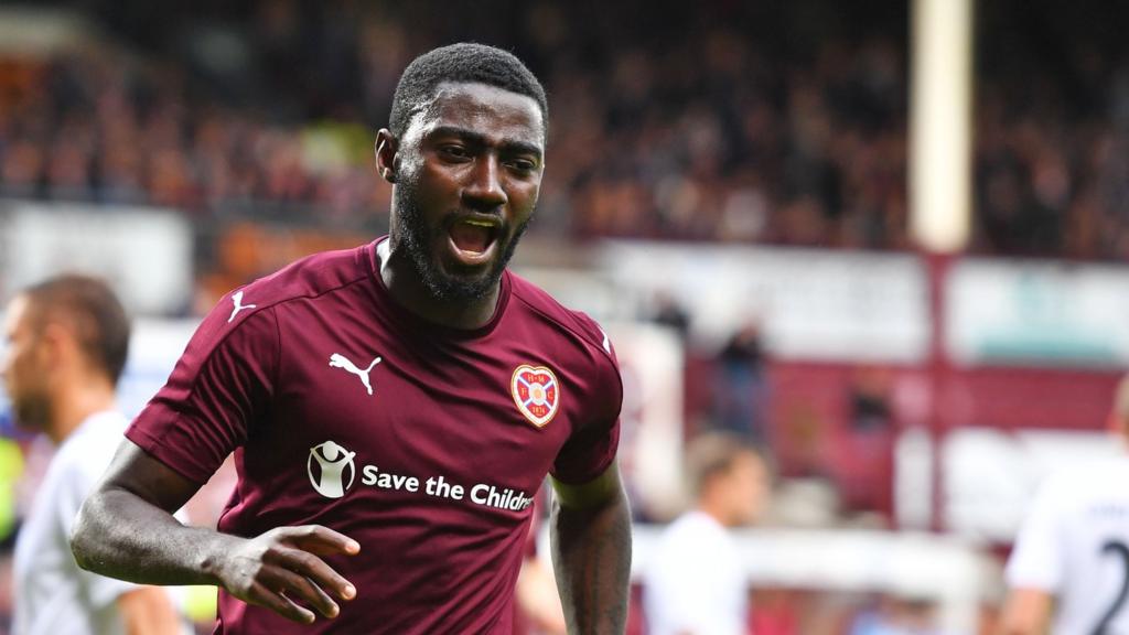 Prince Buaben celebrates his equalising penalty for Hearts