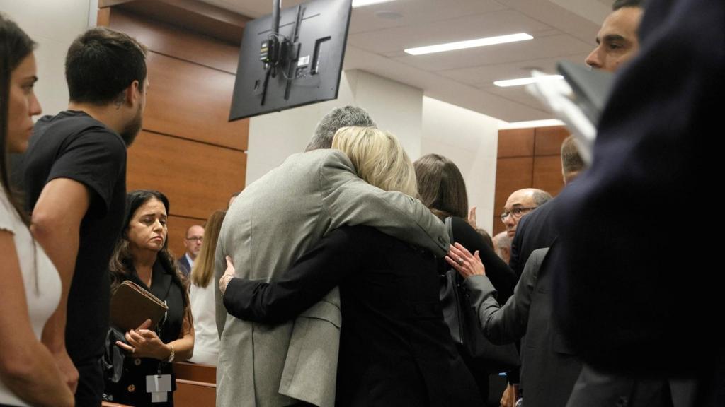 Tom and Gena Hoyer exit the courtroom as Gena could be heard sobbing following the verdict