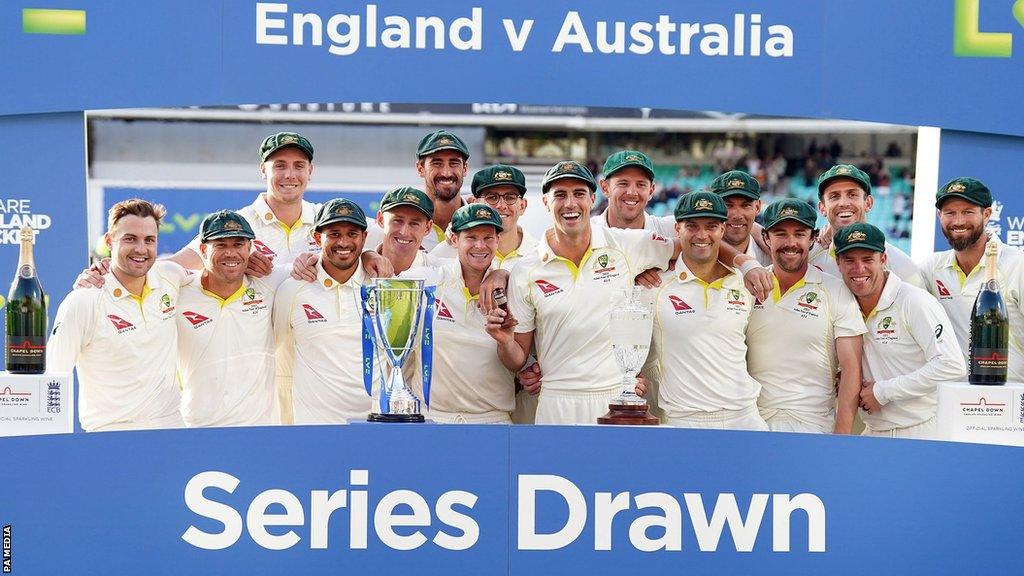 Australia with the Ashes urn after the series was drawn 2-2